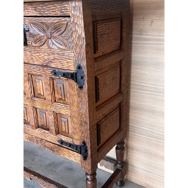 From Northern Spain, constructed of solid walnut, the rectangular top with molded edge atop a conforming case housing two...