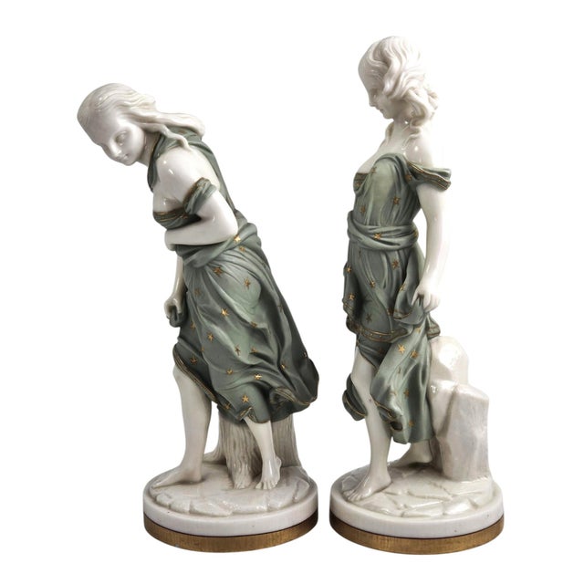 A refined pair of Royal Worcester two-colour Parian figures, "Before the Wind" and "Against the Wind", modelled by James...