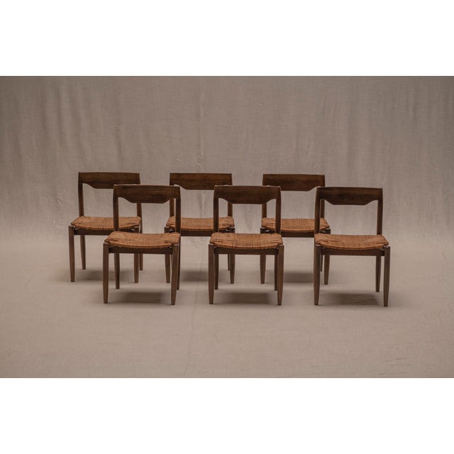 Beautiful set of six mid-century dining chairs, combining robust solid wood construction with refined proportions and...