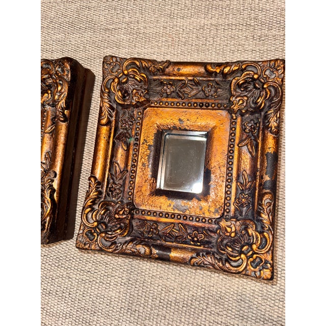 An exquisite, highly coveted triptych set of three (3) vintage small-scale Italian Baroque-style wall mirrors. These...