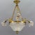 French neoclassical style gilt bronze and glass four-light chandelier. This beautiful chandelier features three arms each...
