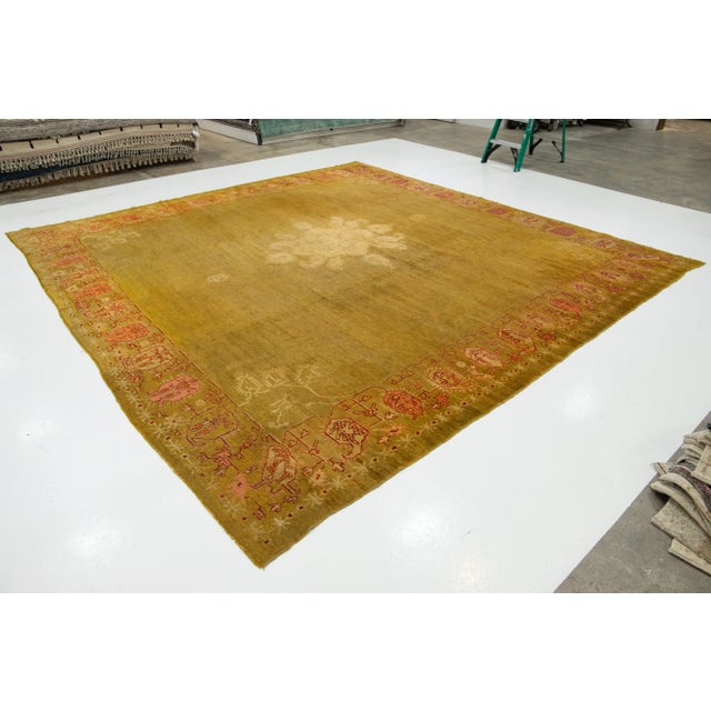 This Turkish Oushak rug is truly one of a kind! It is hand-knotted from soft wool and showcases a stunning goldenrod color...