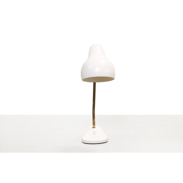 Iconic table lamp designed by Vilhelm Lauritzen and produced by Louis Poulsen in the 1940s. The lamp was designed for the...