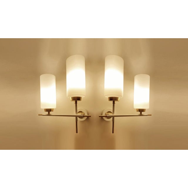 Pair of Vintage mid-century sconces with square opaline glass shades with a contrasting checkered serigraphed pattern,...