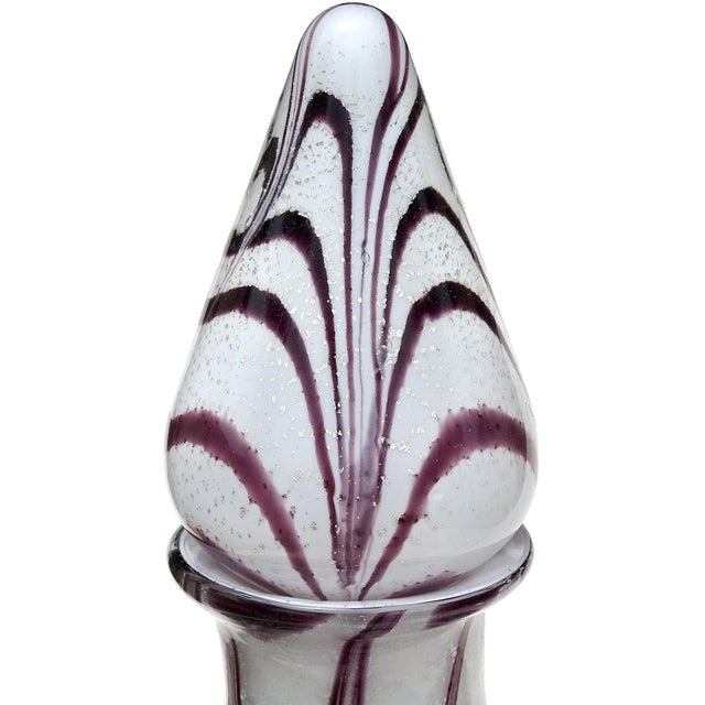 Beautiful vintage Murano hand blown silver flecks and purple swirl over white Italian art glass decanter. Created in the...