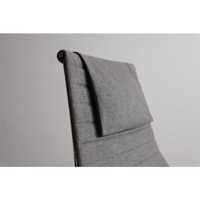 EA124 Aluminium Group swivel lounge chair designed by Charles and Ray Eames for Herman Miller, upholstered in its original...