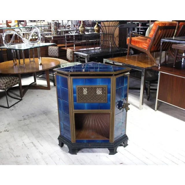 Cobalt blue tile brass trim Austrian corner gas fireplace or heater or hearth. This piece is sure to bring charm to your...