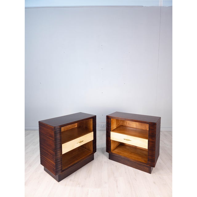 Pair of Italian nightstands attributed to Osvaldo Borsani, distinguished by their refined construction and particularly...