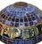 Fine Tiffany Studios table lamp featuring a dark patinated bronze base and a domed leaded-glass shade in rich blue...
