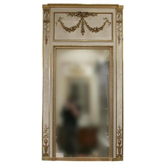 19th century painted French Trumeau in the Louis XVI style. Beautiful water-gilded decorative moldings & floral motifs.