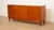 This elegant vintage teak sideboard brings a stylish and cosy atmosphere to any room. The sleek design and warm wood tone...