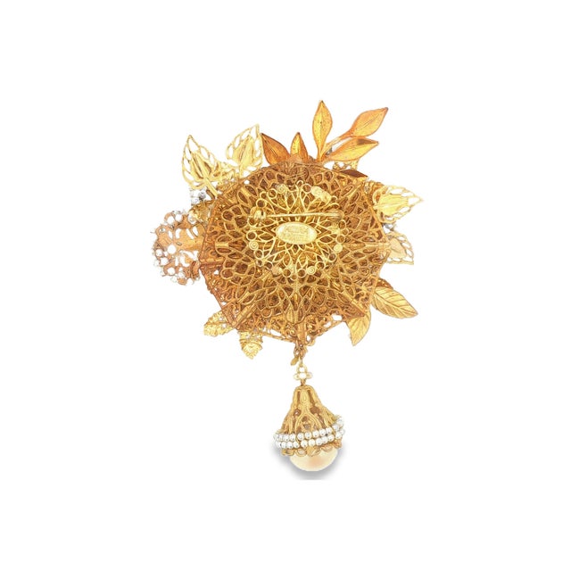 A fabulous large brooch by Miriam Haskell. She was known for her amazing hand-wired floral creations. This brooch features...