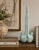 A distinctive sculptural accent featuring two stylized doves seamlessly joined in a striking symmetrical composition....