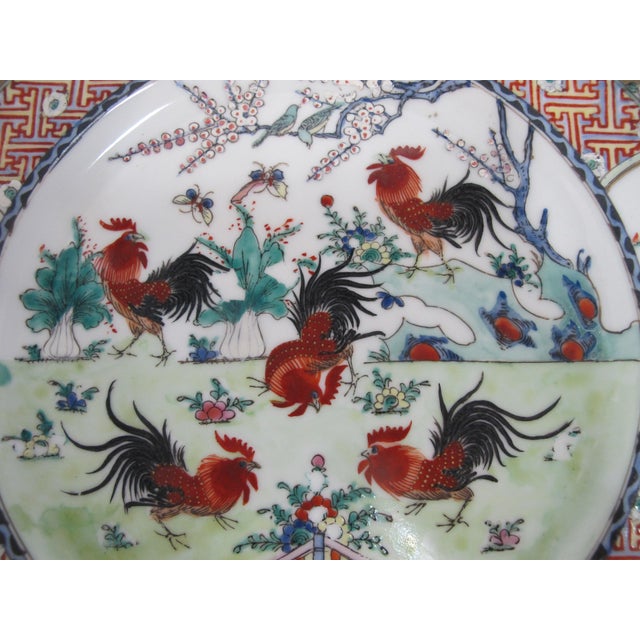 Japanese 20th century porcelain plate, measures 10 1/4". White porcelain hand painted in bold tones of red, green, and...
