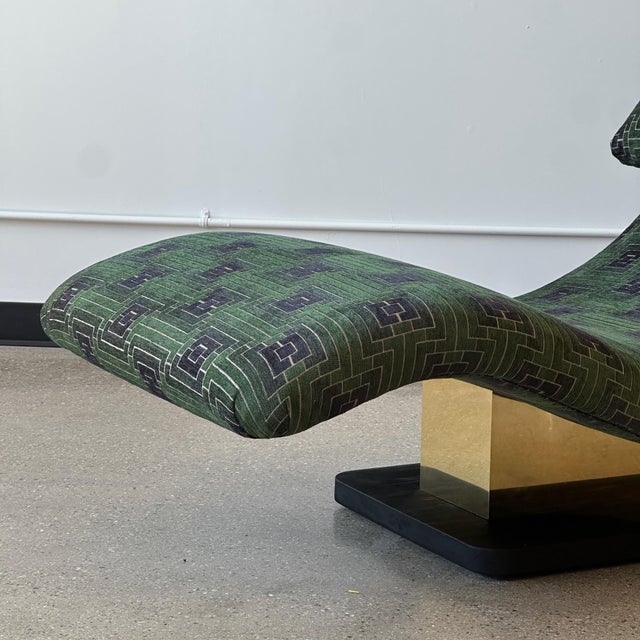 c. 1980. Brass column with ebonized wood base. Reupholstered in green patterned fabric. This piece is attributed to the...