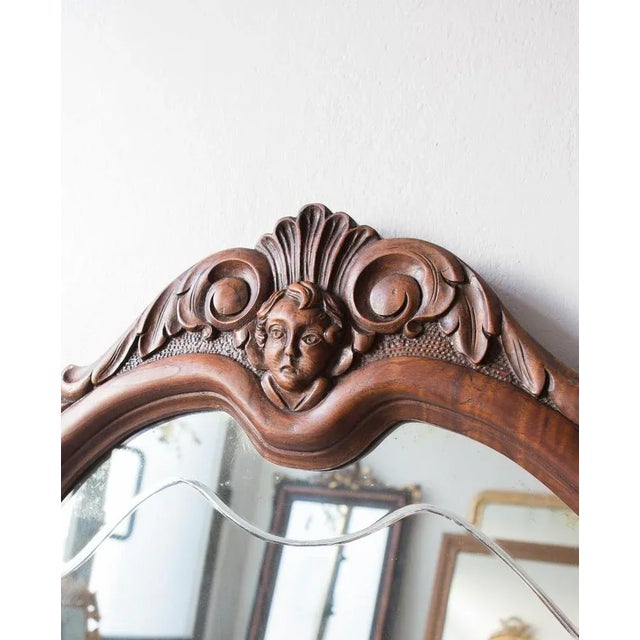Originally the mirror was supported by a chest of drawers.