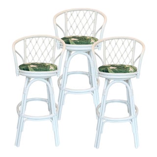 Set of Three Coastal White Rattan Swivel Counter Stools Banana Leaves Upholstery For Sale