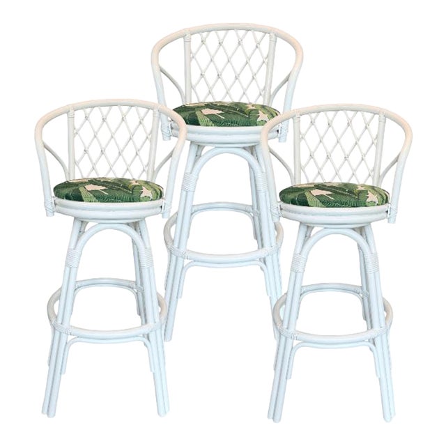 Set of Three Coastal White Rattan Swivel Counter Stools Banana Leaves Upholstery For Sale