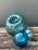 This curated set of five vintage hand-blown glass fishing floats captures the serene beauty and history of the sea....