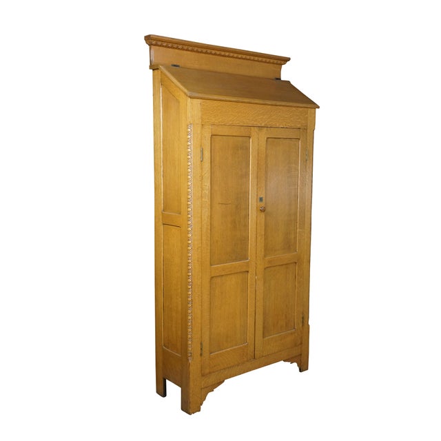 75-inch-tall antique Golden Oak schoolhouse supply cabinet, bookkeeper’s standing secretary, bookcase or wardrobe, circa...