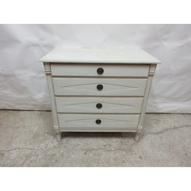 This is a Swedish Gustavian Style 4 Drawer Chest ,it has been restored and repainted with Milk Paints "Oyster White"