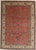 Antique hand-knotted Persian Mahal wool rug with a red field featuring an allover floral pattern of scrolling vines,...