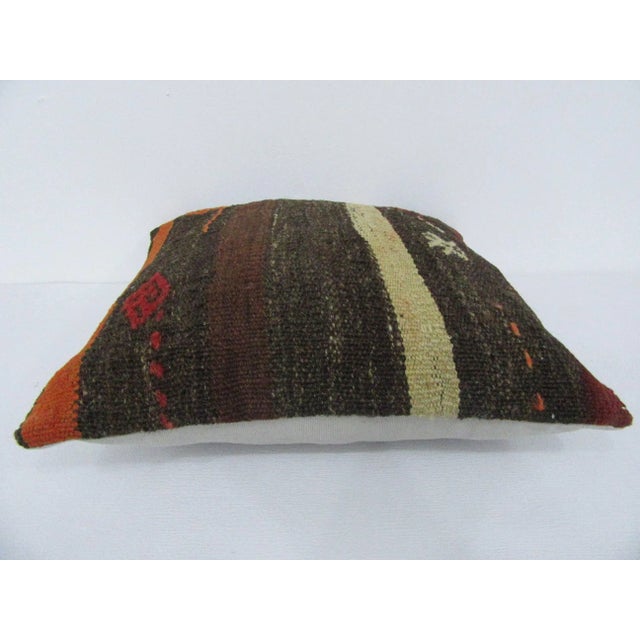 Handmade decorative pillow cover made from a vintage Turkish kilim rug. Backed with good quality cotton fabric. Pillow...