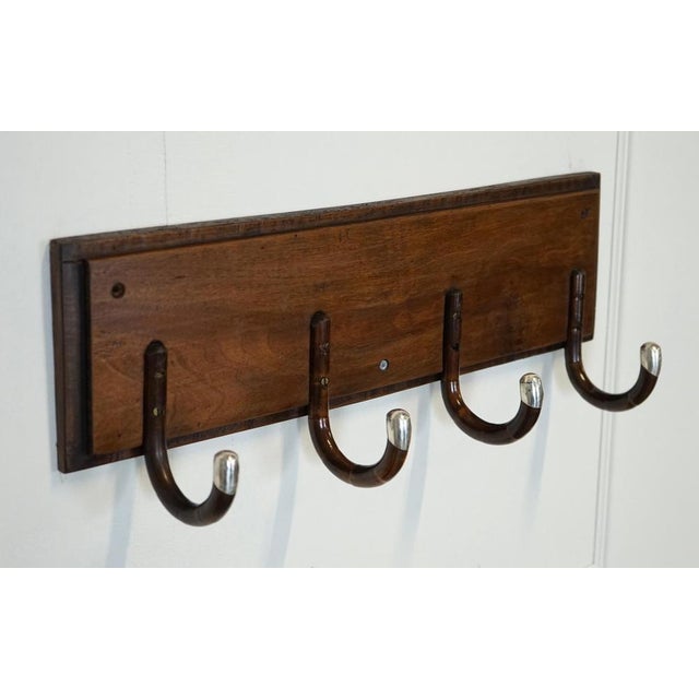 Art Deco hat coat wall rack from the 1920s. A striking and highly collectible piece. It is made from four canes, adding to...