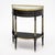 An exceptionally elegant French Louis XVI demi-lune console table, circa 1790, crafted in ebonized mahogany and retaining...