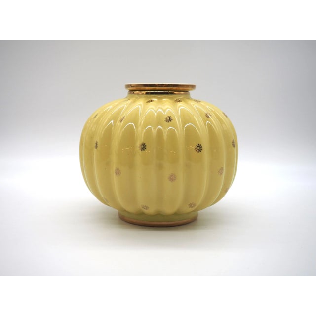 A very rare Art Deco vase with high quality, made by Arthur Percy for Upsala Ekeby. It has a buttery yellow background...