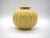 A very rare Art Deco vase with high quality, made by Arthur Percy for Upsala Ekeby. It has a buttery yellow background...