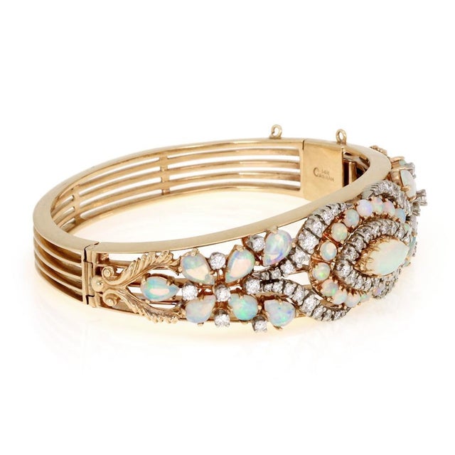 This is a gorgeous Estate bracelet, it is crafted from 14k yellow gold featuring a wide dome shape front half set with...