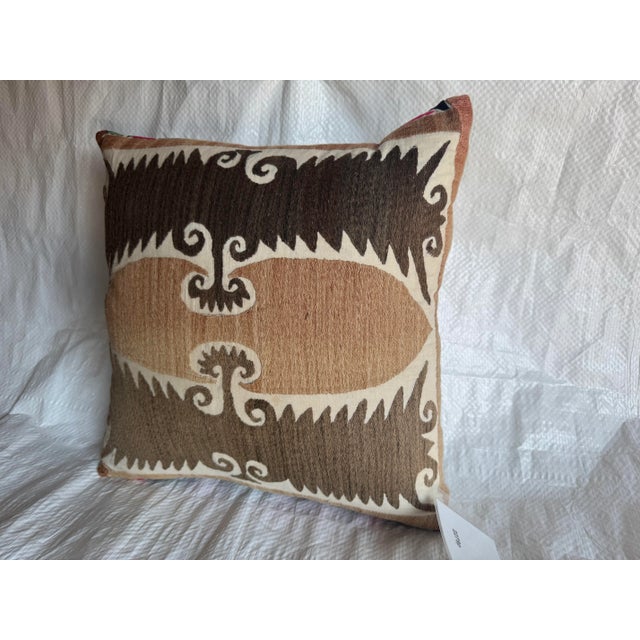 This distinctive antique 1900s Suzani pillow is created from an early 20th-century Central Asian embroidered textile,...