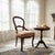 Bring timeless elegance to your home with this Antique Victorian Balloon Back Side Chair, beautifully crafted in the late...