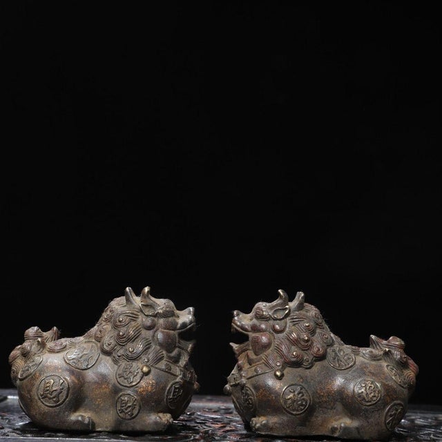 This charming pair of figures depicts Pixiu, mythical beasts traditionally associated with attracting wealth and warding...