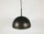 Staff brown hanging lamp made in Germany in the 1970s. The brown lamp shade is made of bakelit. It has a round white...