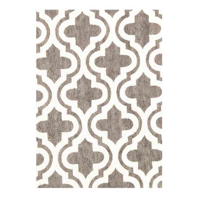 Modern Hand-Tufted Area Rug made of fine pure lamb's wool. Easy care and maintenance. The timeless style of this rug will...