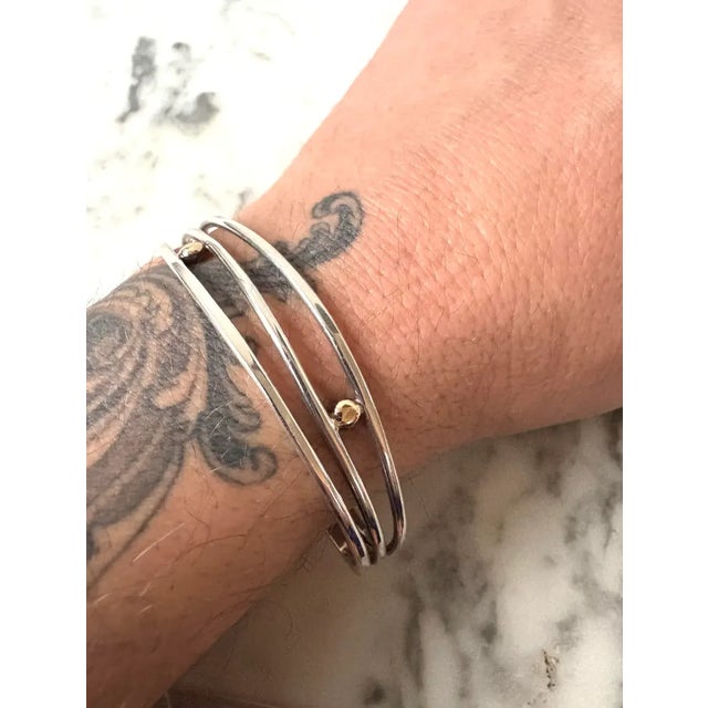 Lovely sterling silver and 14 karat gold wire cuff bracelet. Beautiful detail and quality.