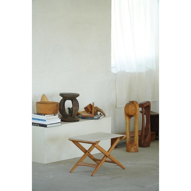 A Swedish Modern Model 203 folding stool designed by Uno & Östen Kristiansson for Luxus Vittsjö in the 1960s. Crafted in...
