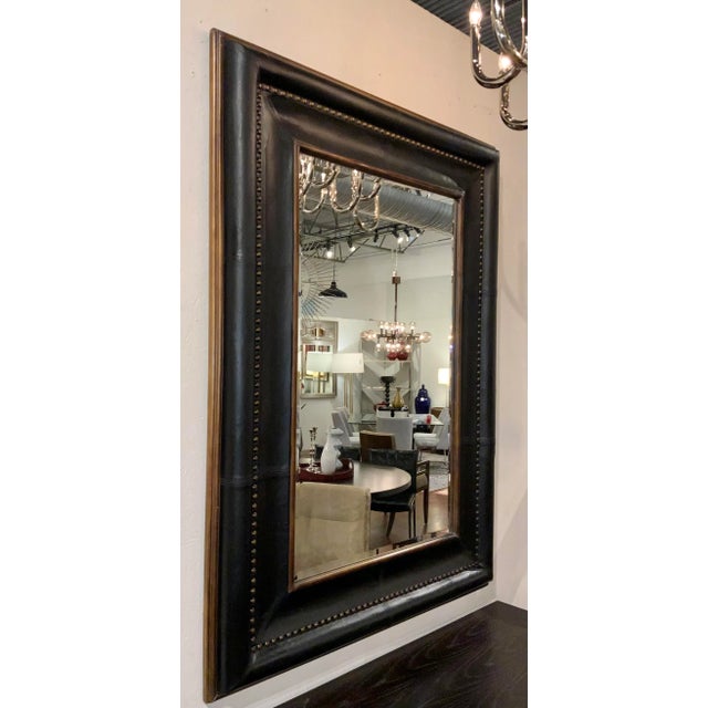 Stylish Large Transitional Black Leather Wall Mirror, wood accents, antique brass finished nailhead design, beveled...