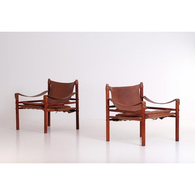 Pair of safari chairs model Sirocco in good condition with original leather. Designed by Arne Norell, produced by Arne...