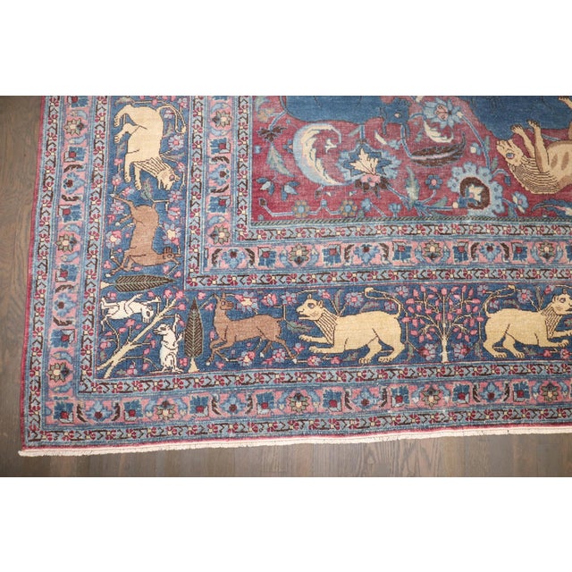 A stunning 1900s Persian Meshed Conversational Animal Motif Statement Rug