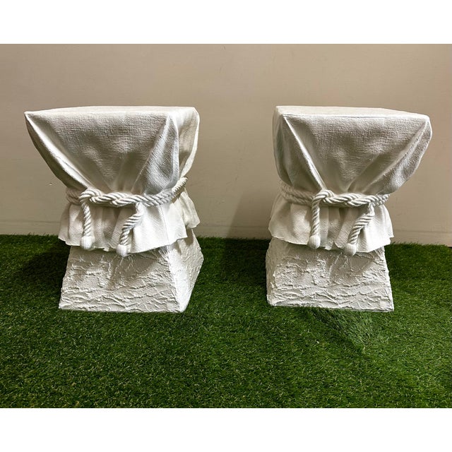 A great pair of Trompe-Loeil bright white draped plaster pedestals or garden stools. In great condition. No chips or...