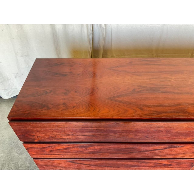 Arne Wahl Iversen for Vinde Mobelfabrik Mid Century Rosewood Dresser in good estate condition. There is light wear and...