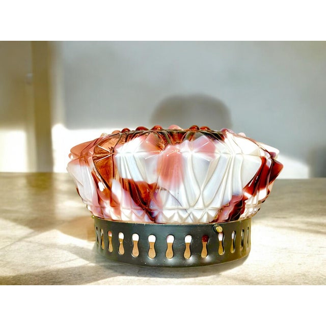 Flush Mounting Ceiling Lights One of the rare flush mount ceiling lights, made of spatter cut glass and secured by a black...