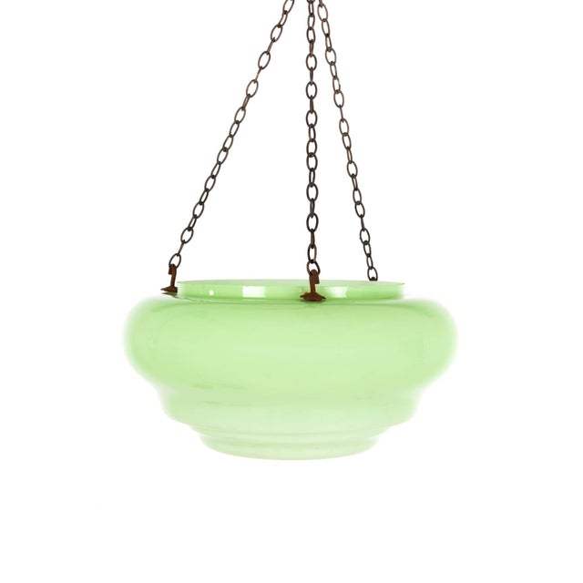A wonderful Art Deco lime green glass Plafonnier or ‘fly catcher’. Featuring three metal hooks on the rim of the glass...