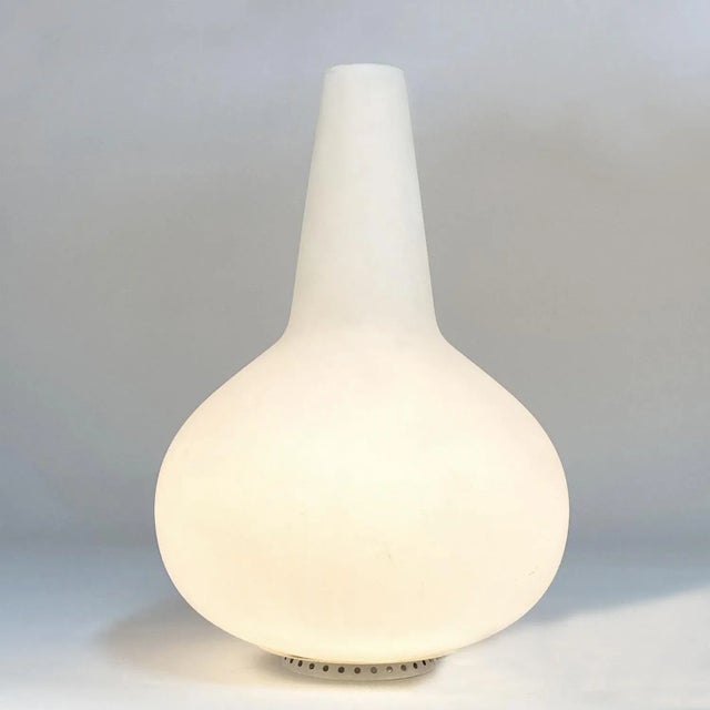 Satin blown glass vase & lamp designed by Fontana Arte, Italy circa 1950s. This extraordinary table lamp functions not...
