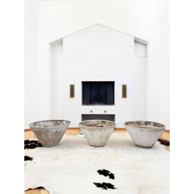 Conical concrete planter created by Willy Guhl for Eternit. We currently have three available, sold here as a set with...