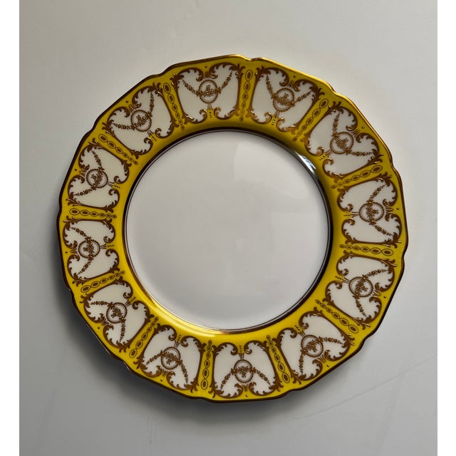 Stunning Royal Doulton bone china service plates. The background is a rare and brilliant canary yellow with neoclassical...