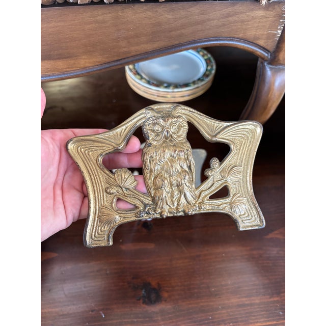 Antique owl sliding book rack, styled after H.L. Judd Company. Book end includes a detailed "wise owl" perched on a pine...